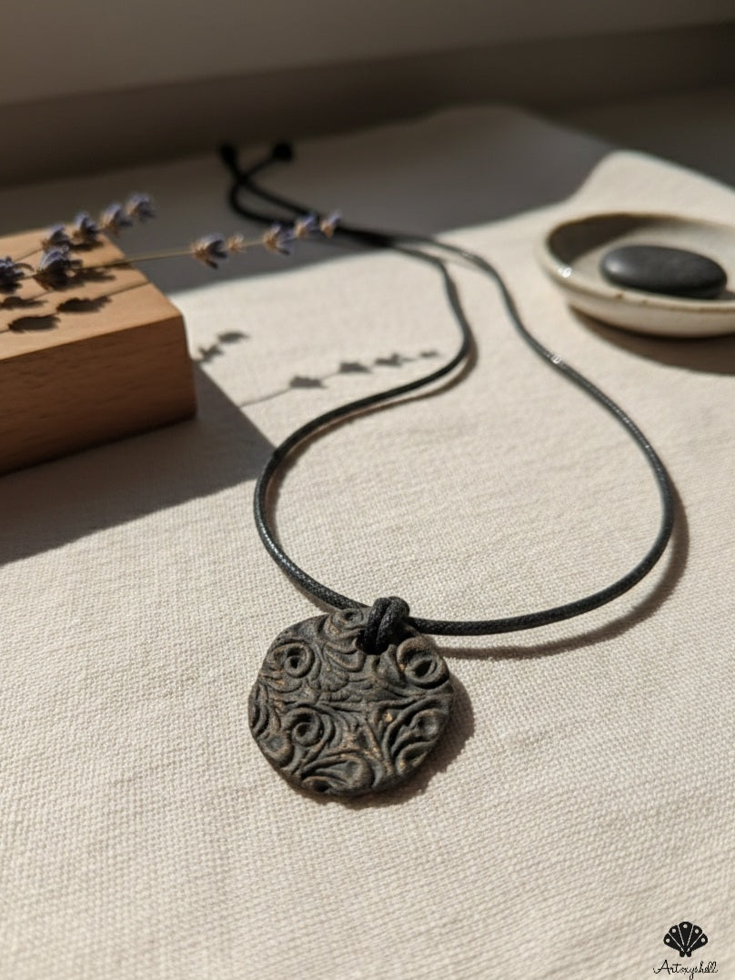 Artisanal Spirals: Hand-Carved Ceramic 'Earth Echo' Pendant